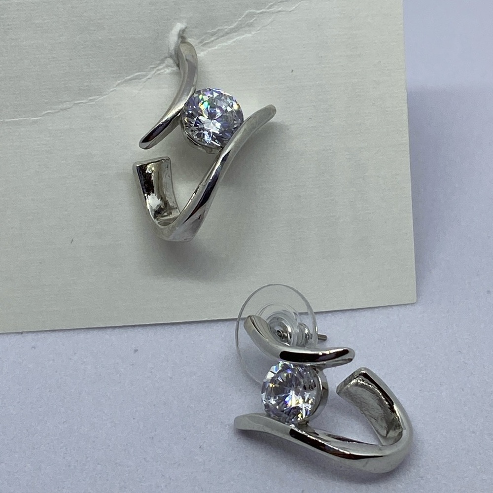 Silver tone Contemporary clear CZ pierced earrings.